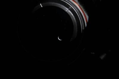 Crescent Earth through a camera lens